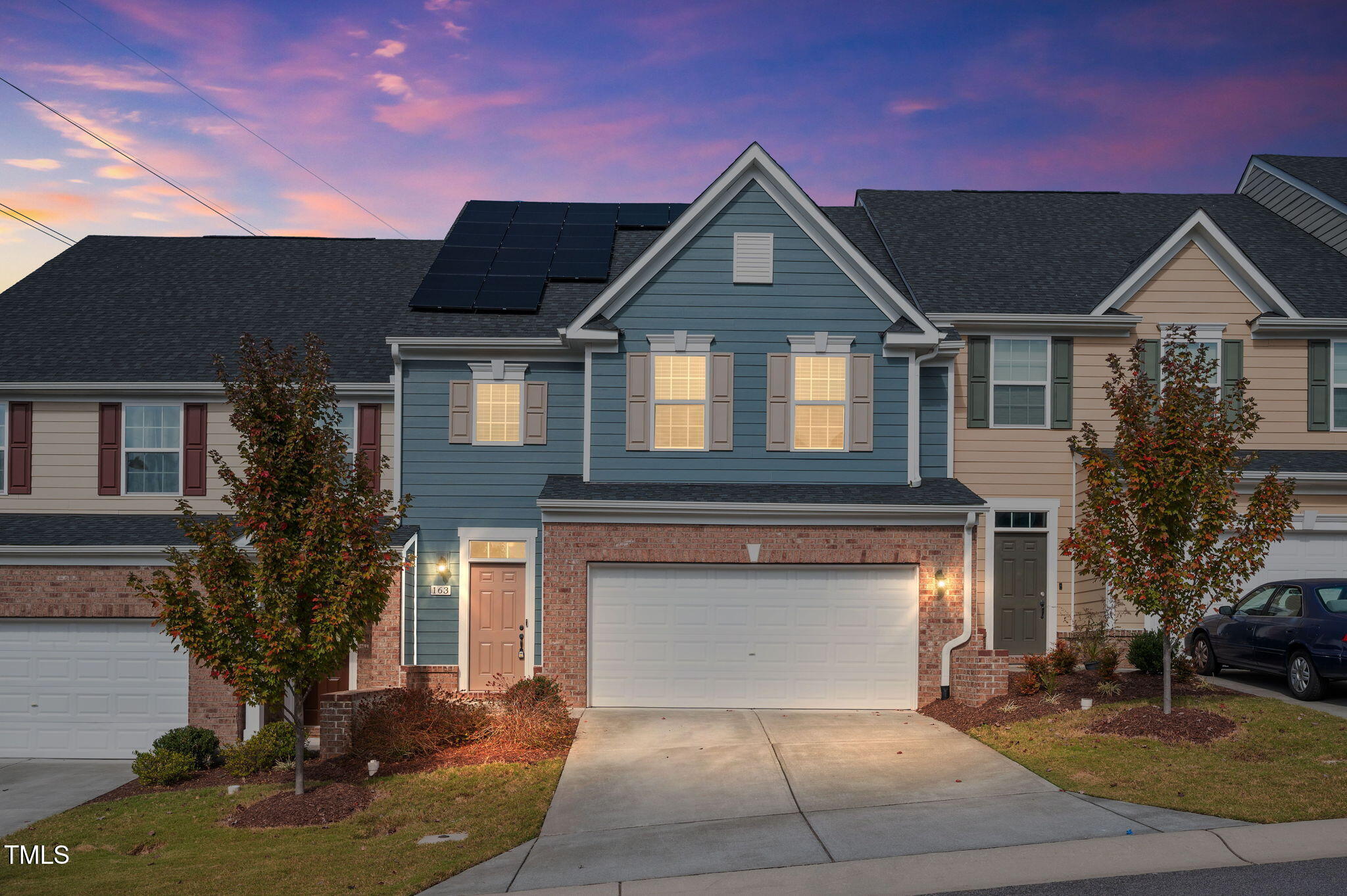 a front view of a house with a yard