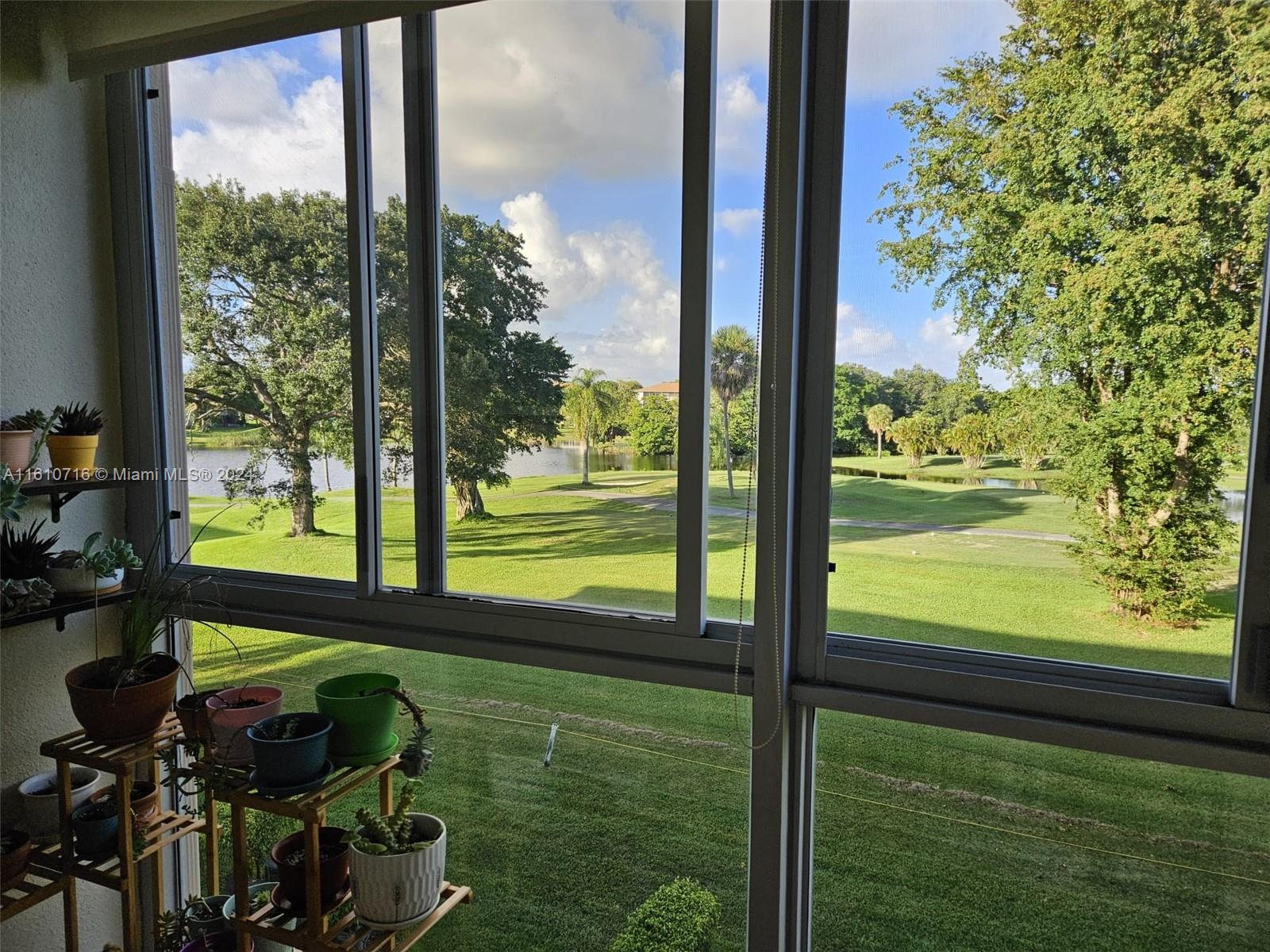 a view of a back yard from a balcony