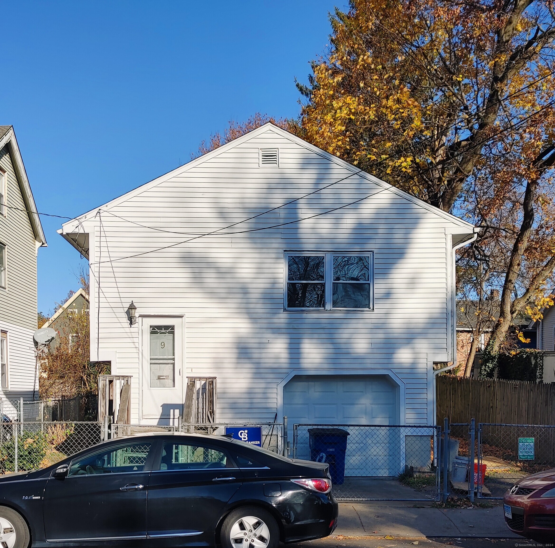 a front view of a house with parking space