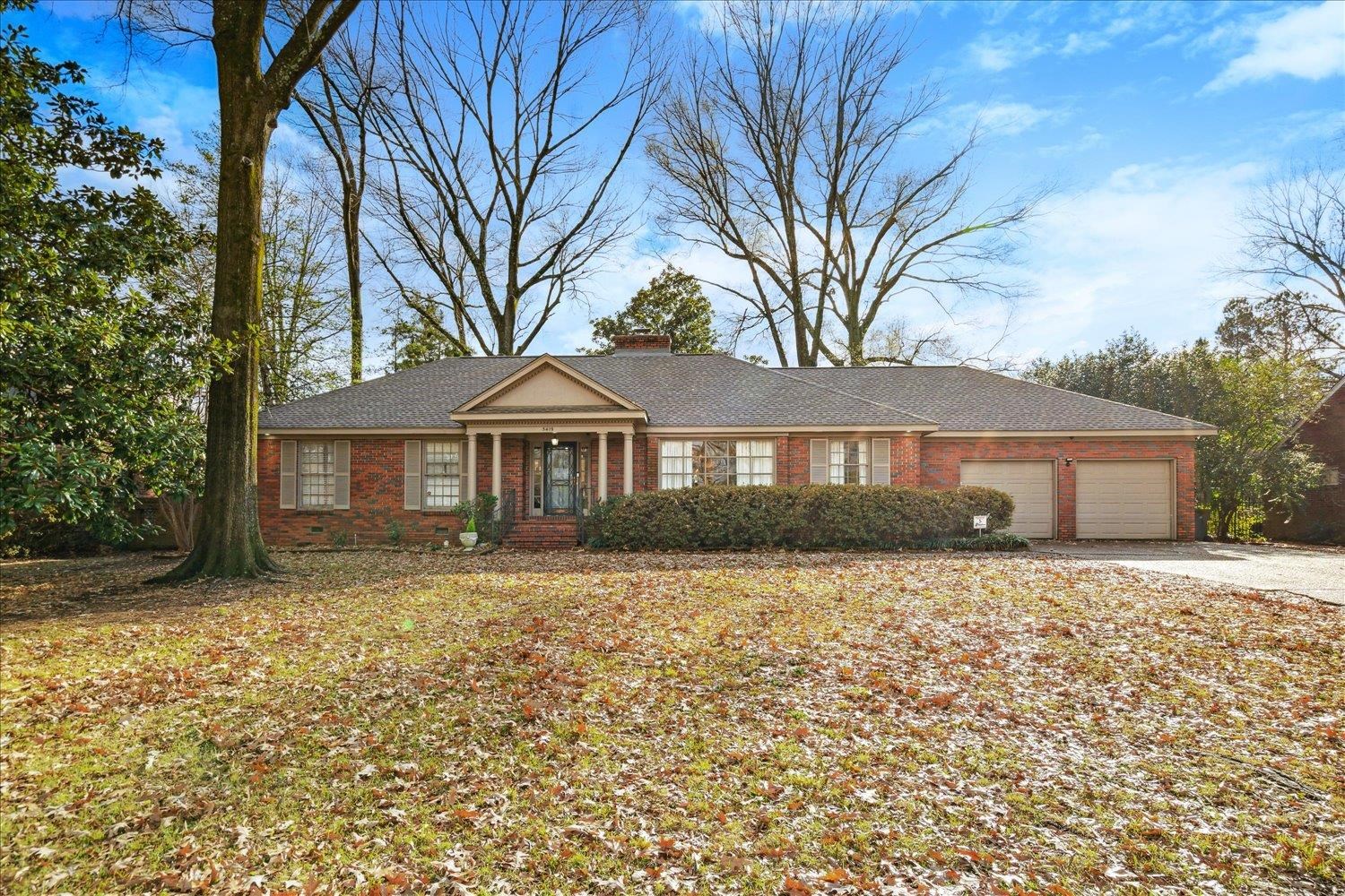 a front view of a house with yard