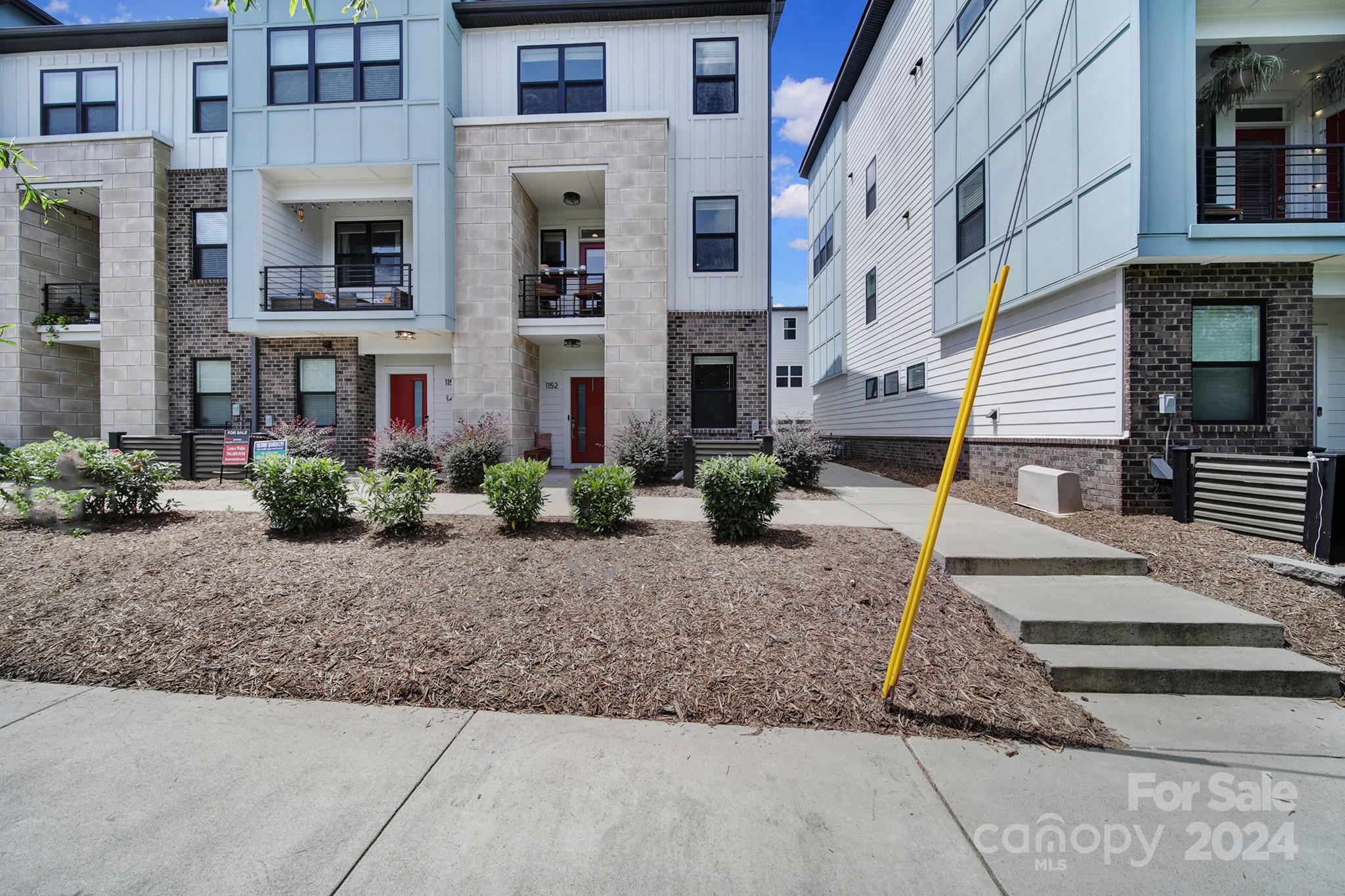 a front view of a building with street view