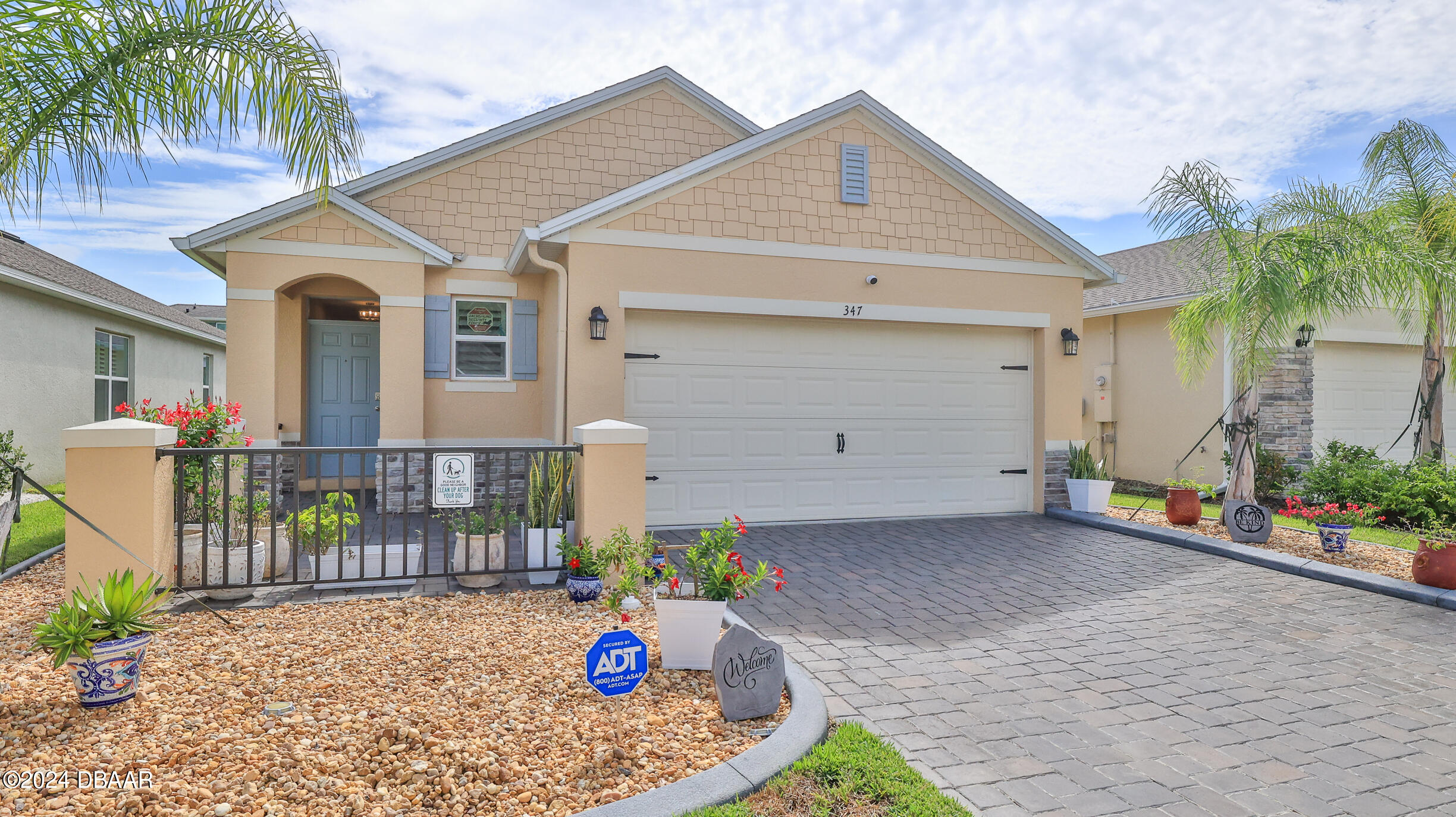 a front view of house with an outdoor seating