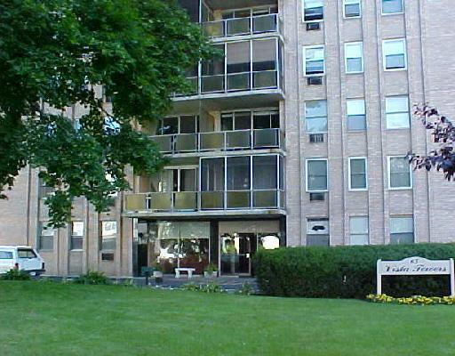 a view of a building with a yard