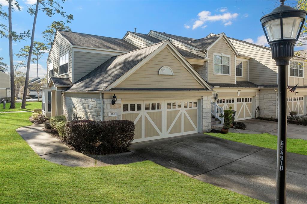 Attached two car garage with end single story unit