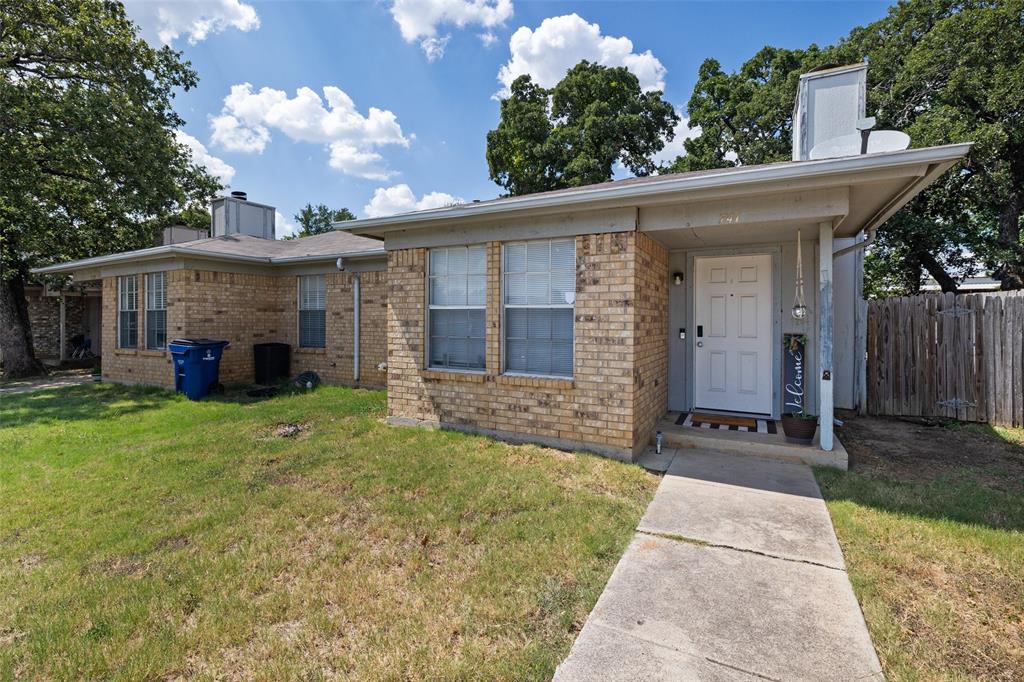 front view of a house with a yard