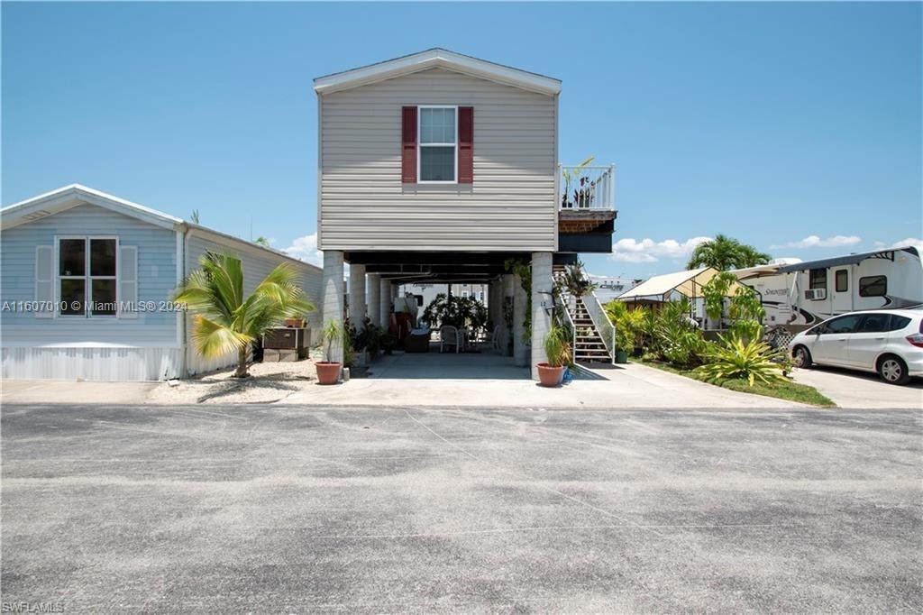 a front view of a house with a yard and a garage