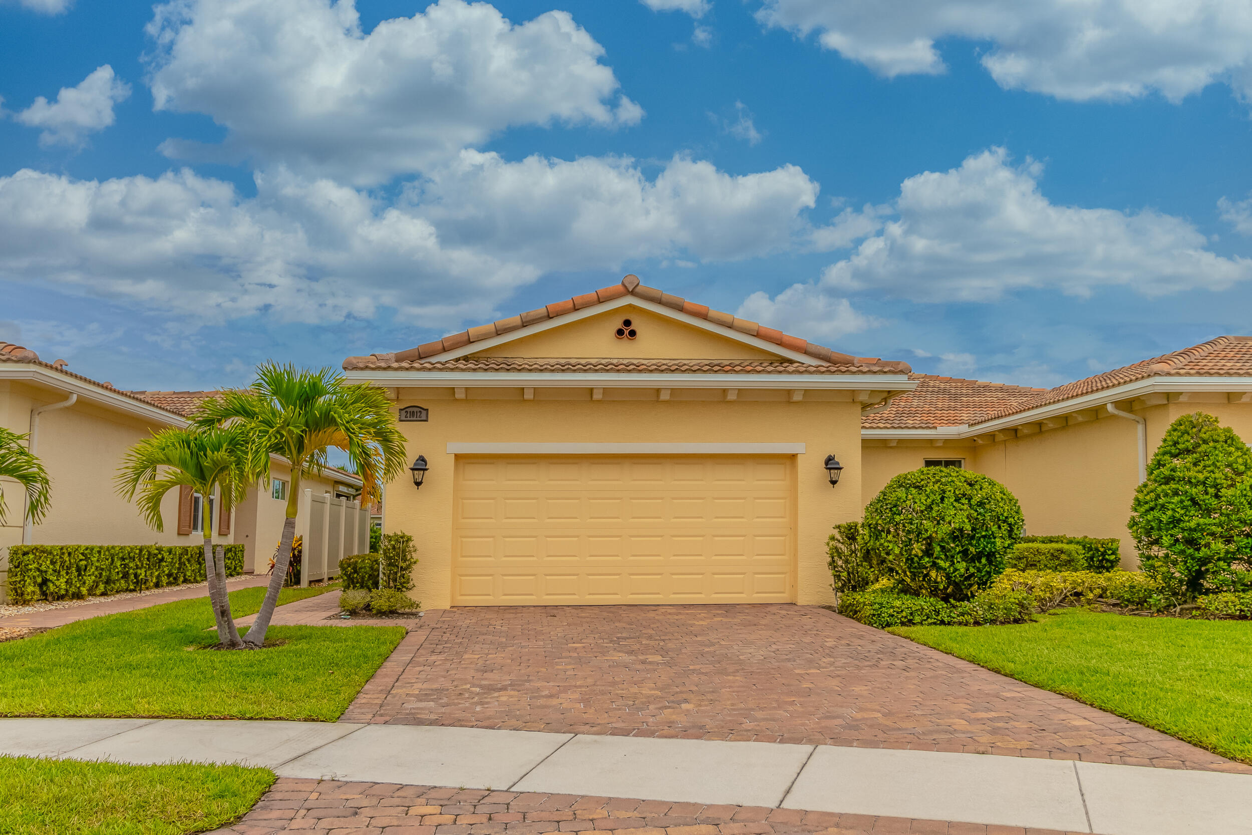 a front view of a house with a yard