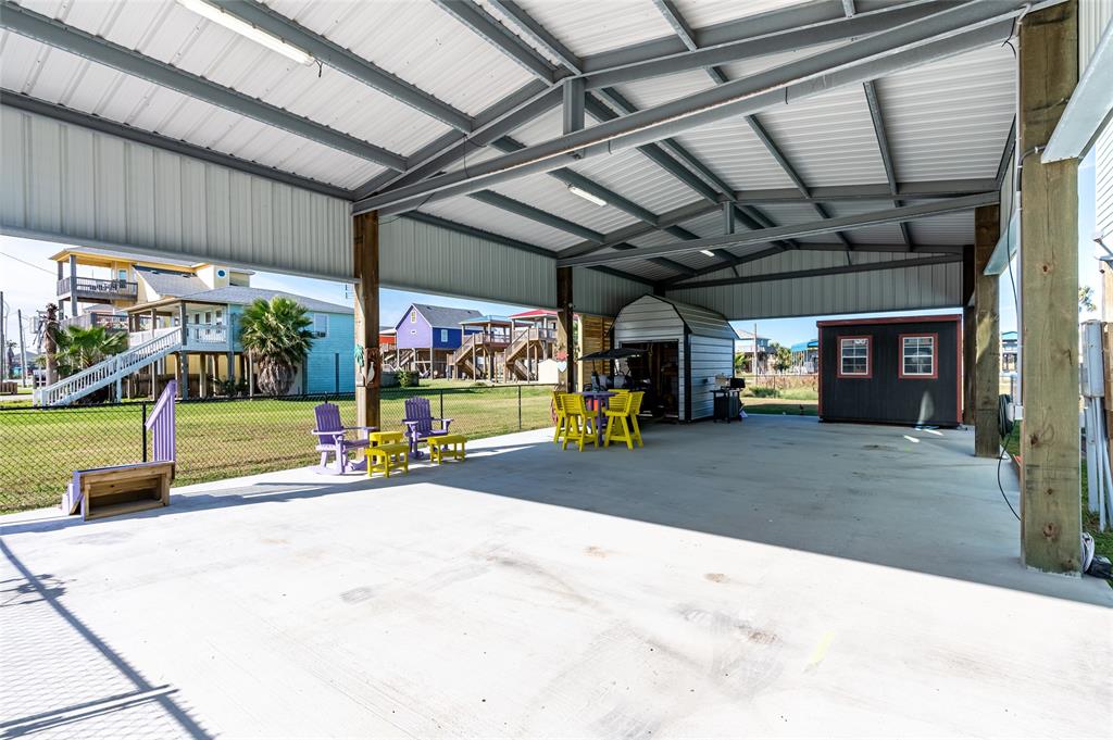 a view of a garage with an outdoor space