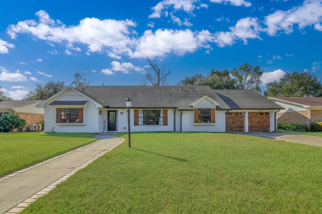 Expansive, manicured lawn welcomes you to a serene home setting.