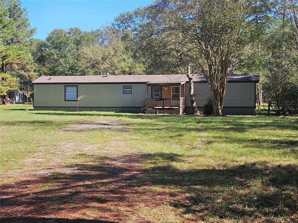 a view of a house with a big yard