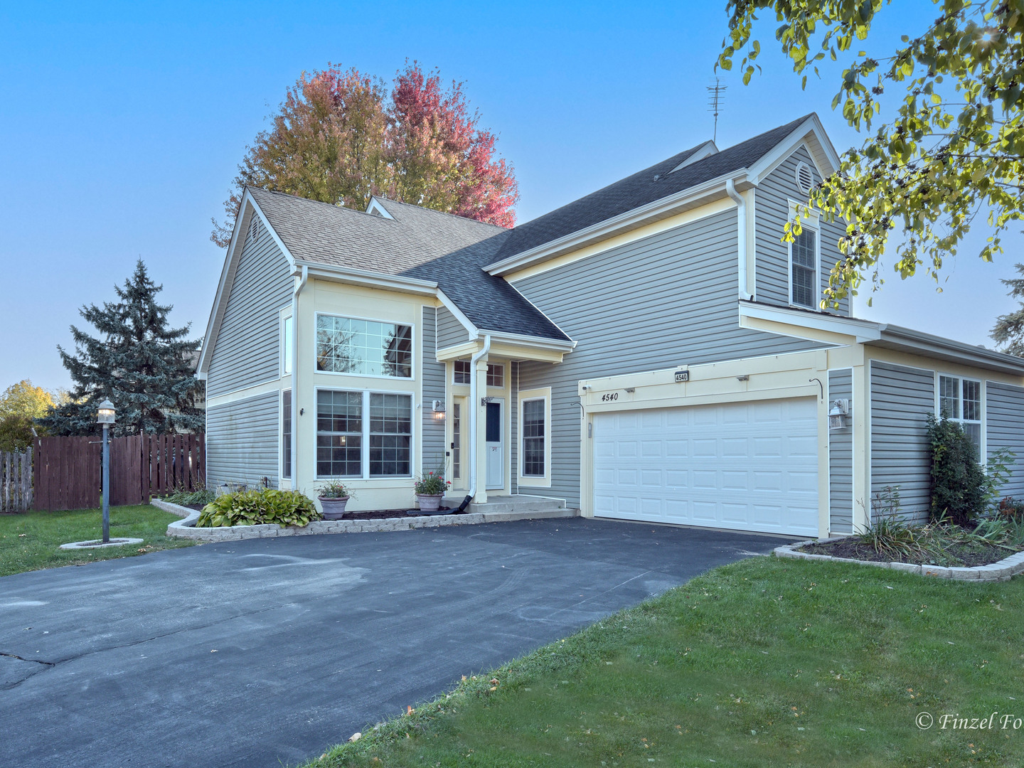 front view of a house with a yard