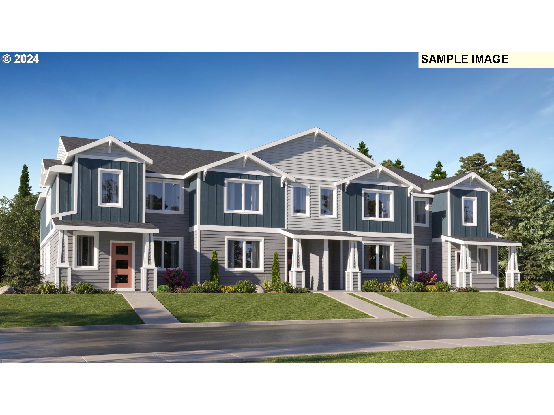 a front view of residential houses with yard