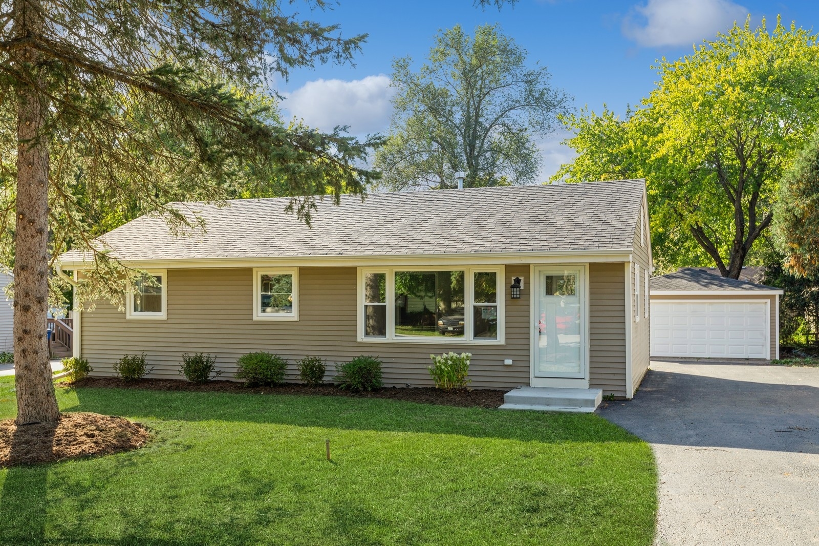 front view of a house with a yard