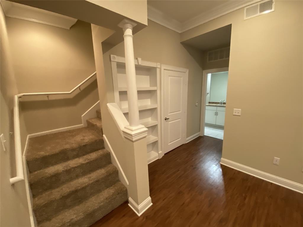 a view of entryway with wooden floor