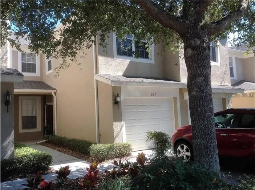 a front view of a house with yard