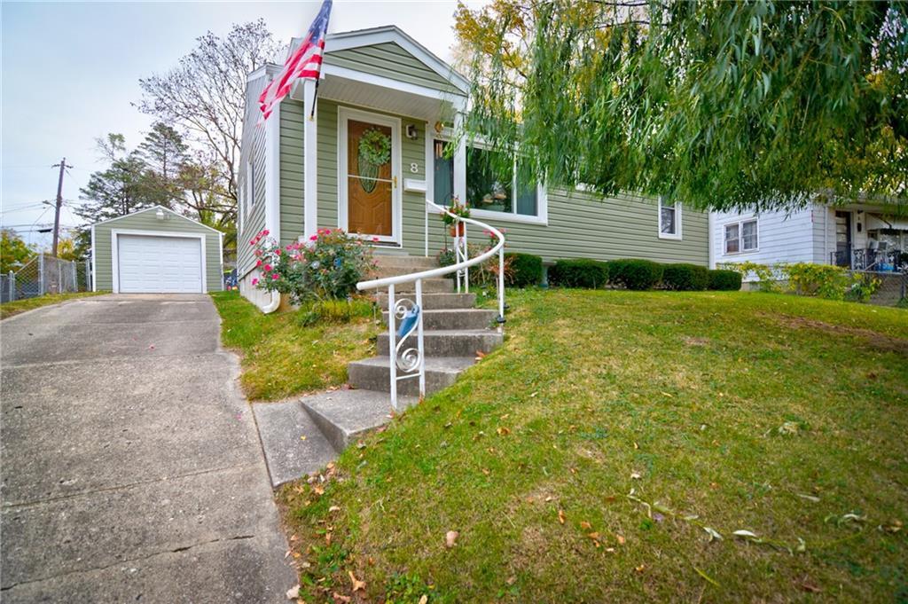 front view of a house with a yard