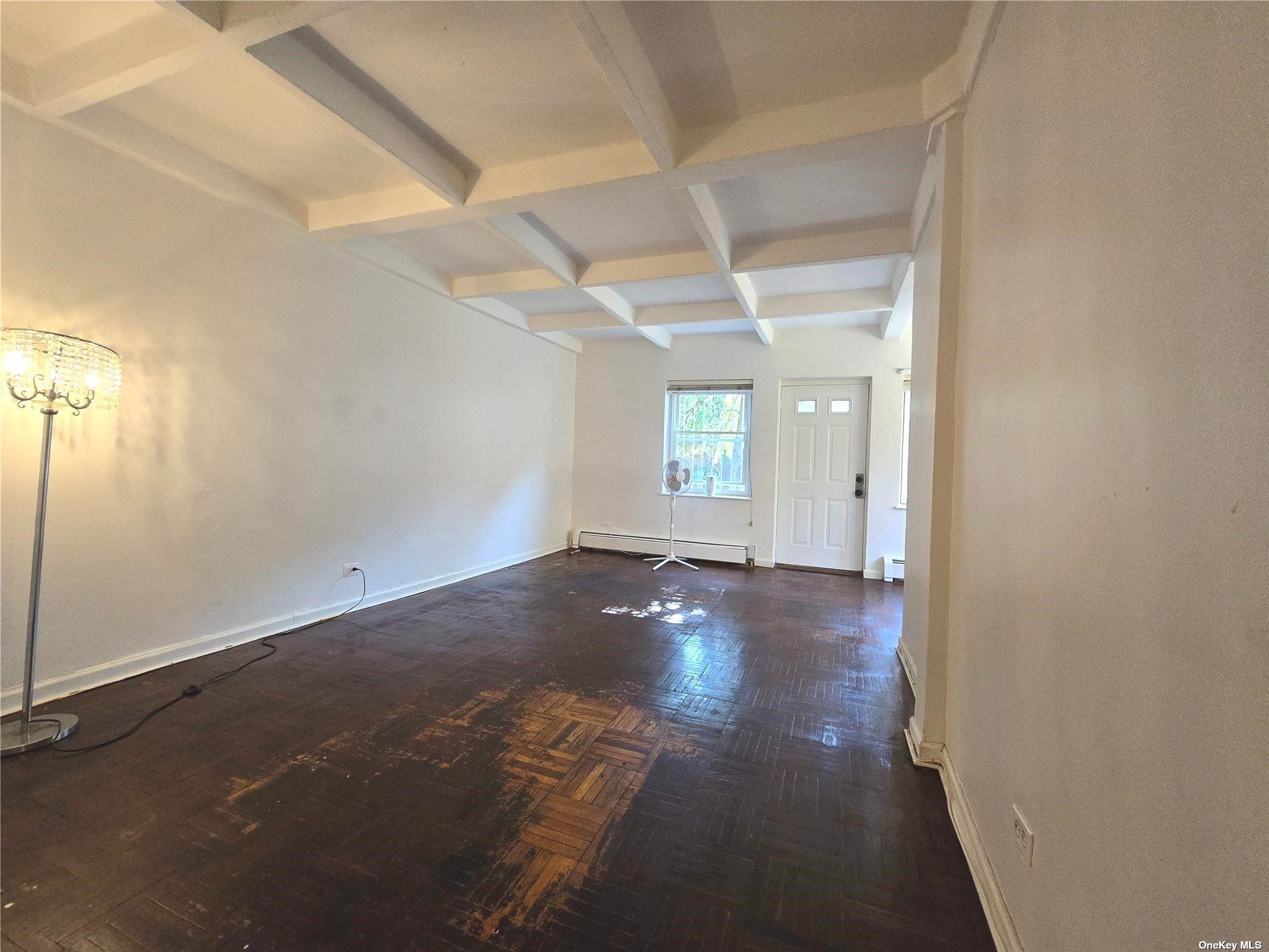 an empty room with windows and mirror view