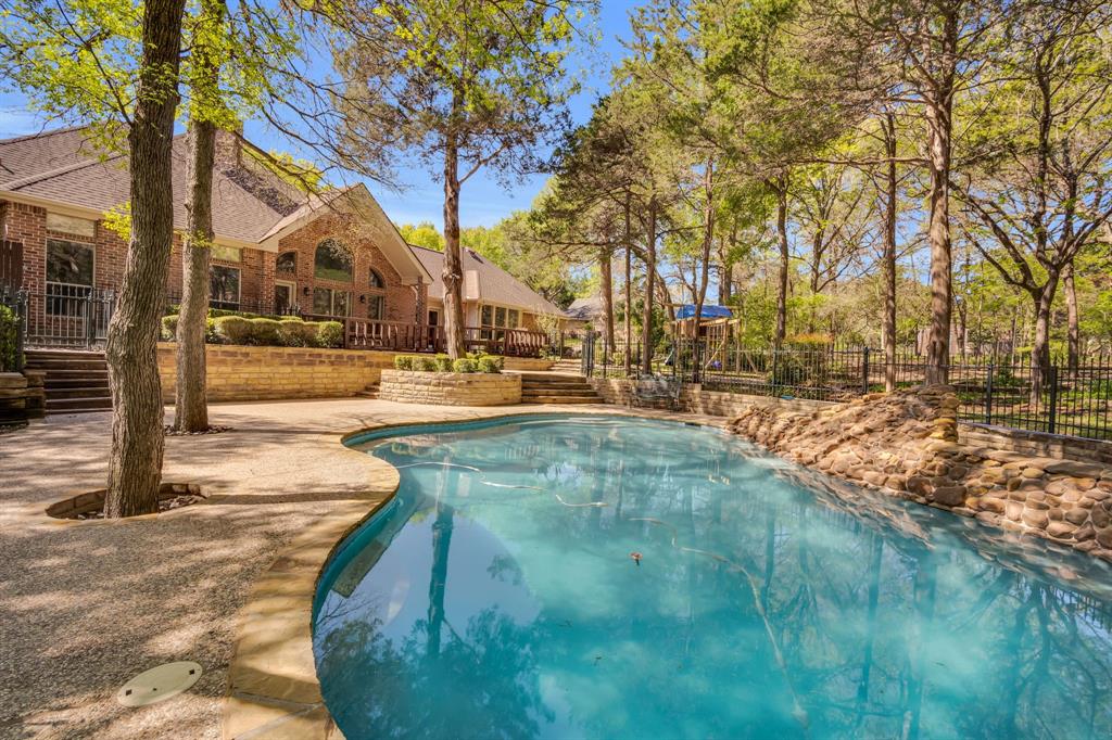 a view of yard with swimming pool