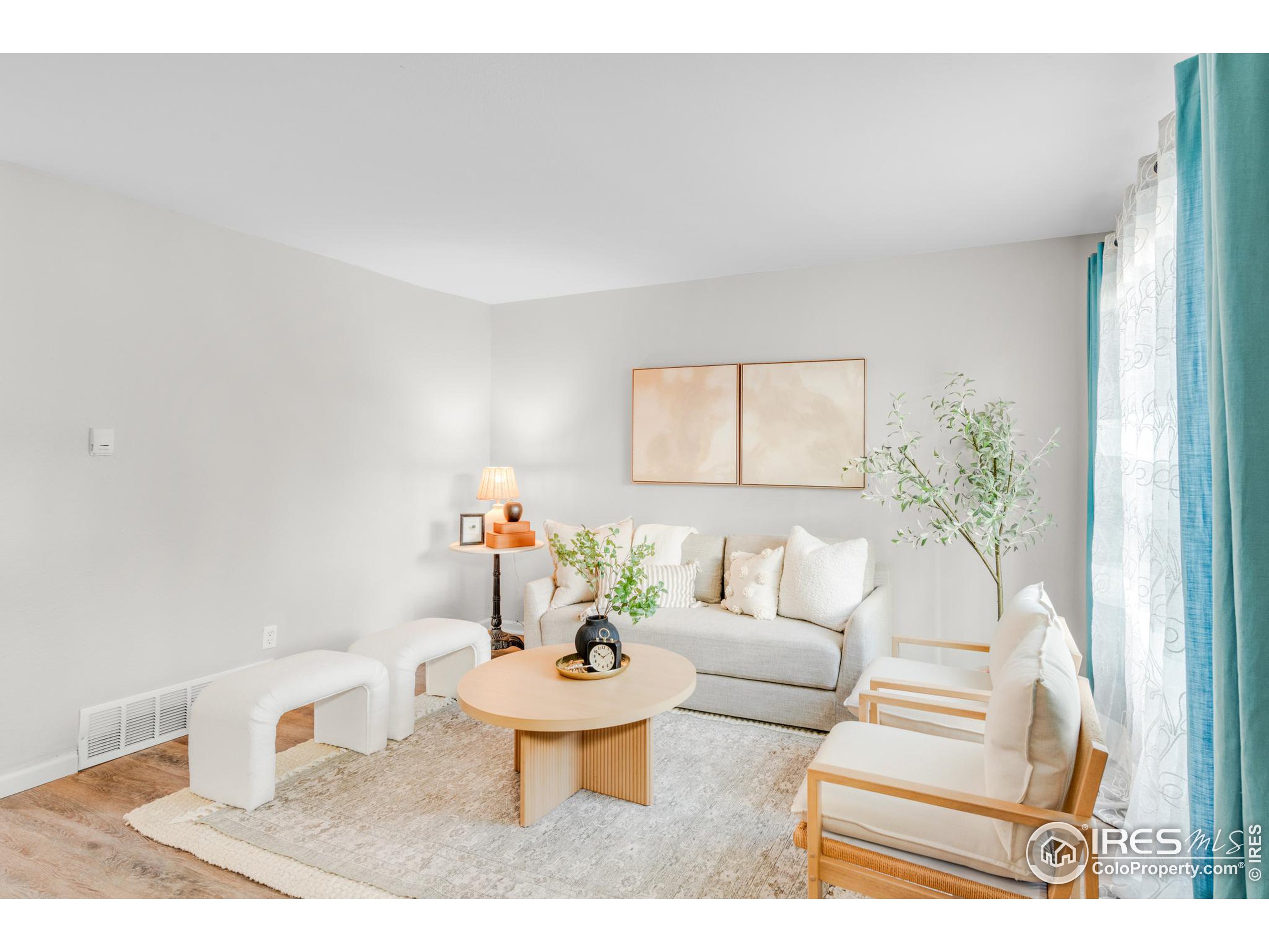 a living room with furniture and a table