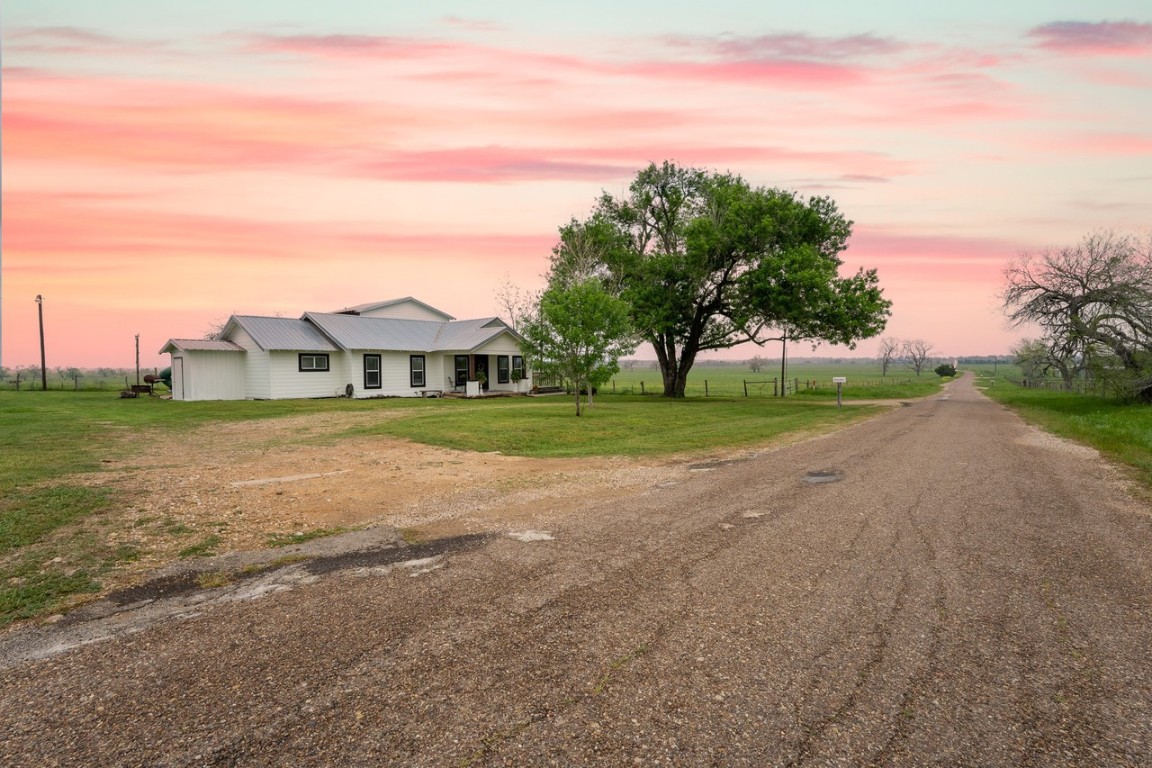 a view of an house with outdoor space and street view