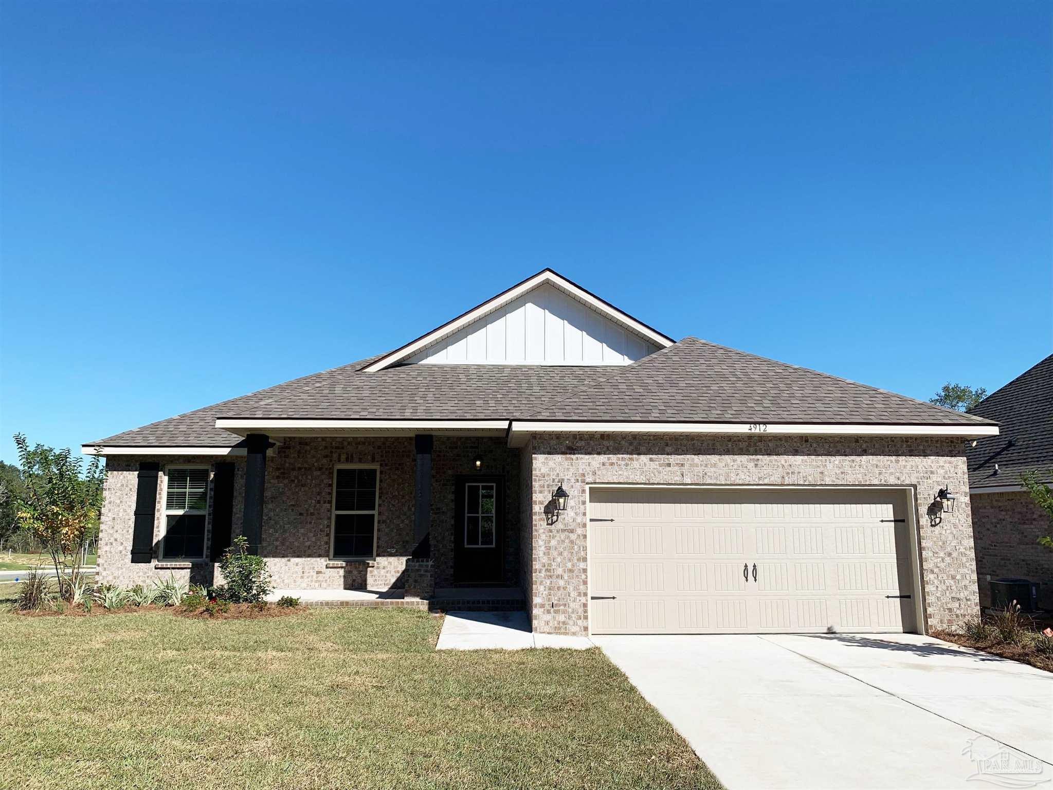 a front view of a house with yard