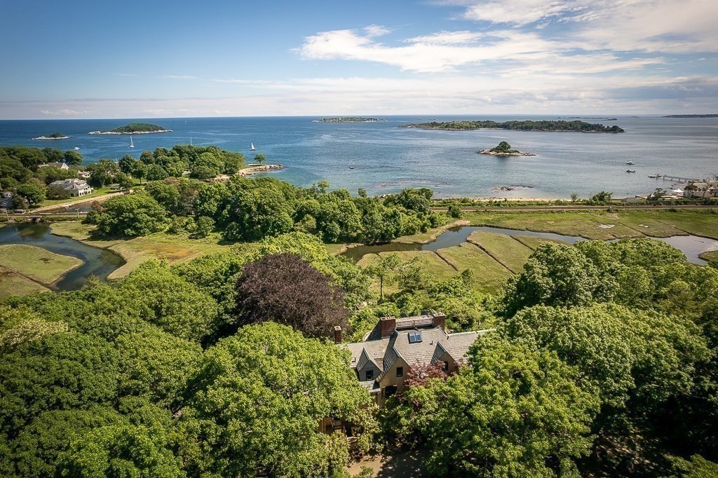 an aerial view of a house with a yard