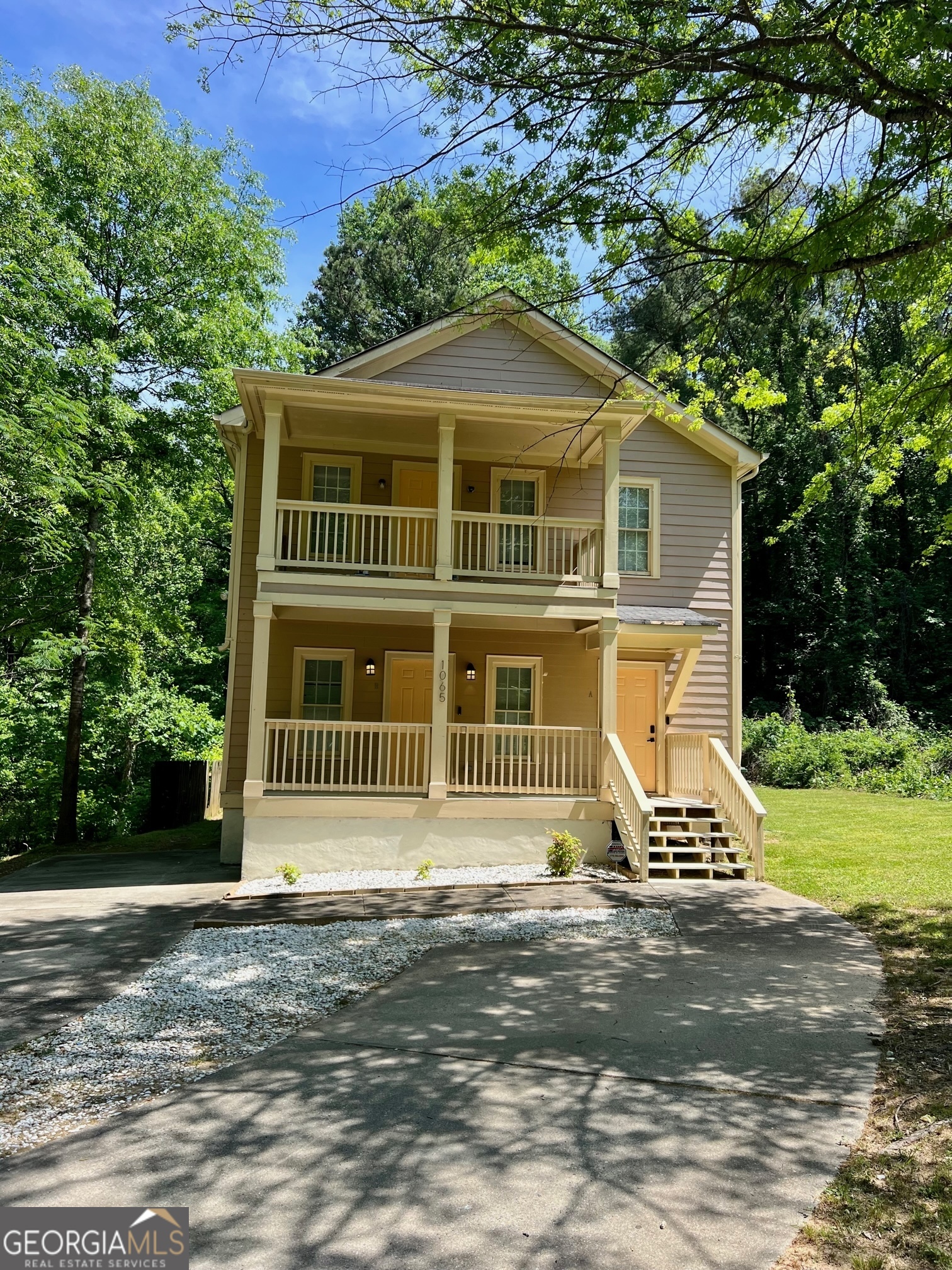 a front view of a house with a yard