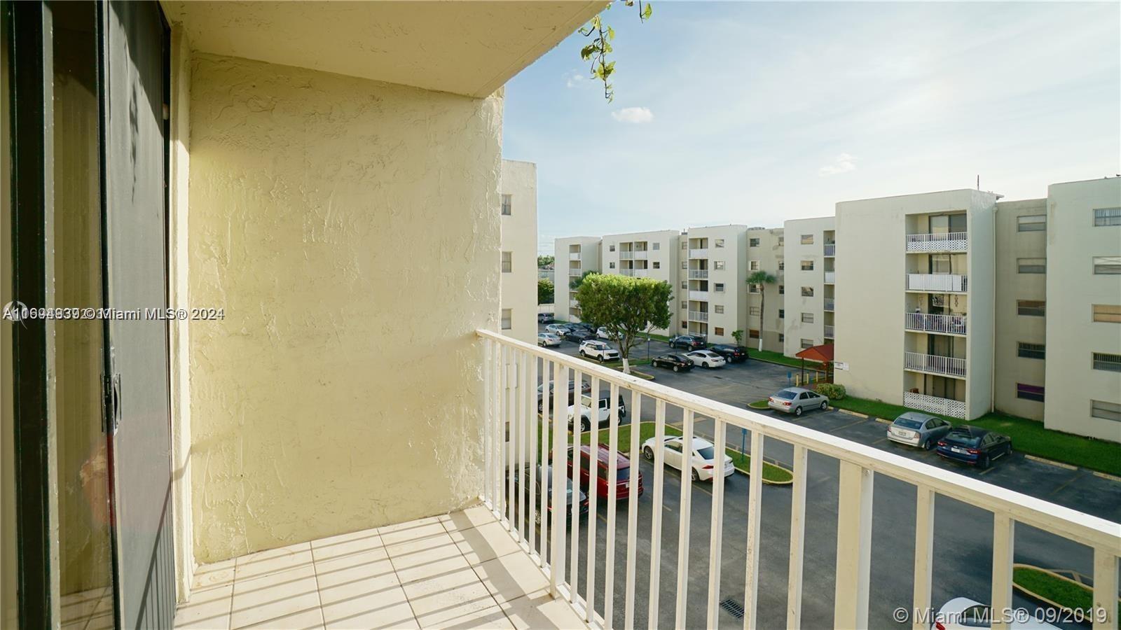 a view of a balcony with city view