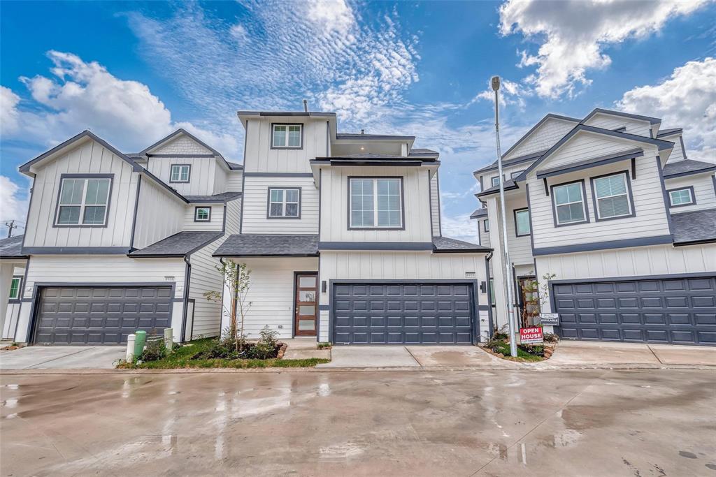 a front view of a house with a garage