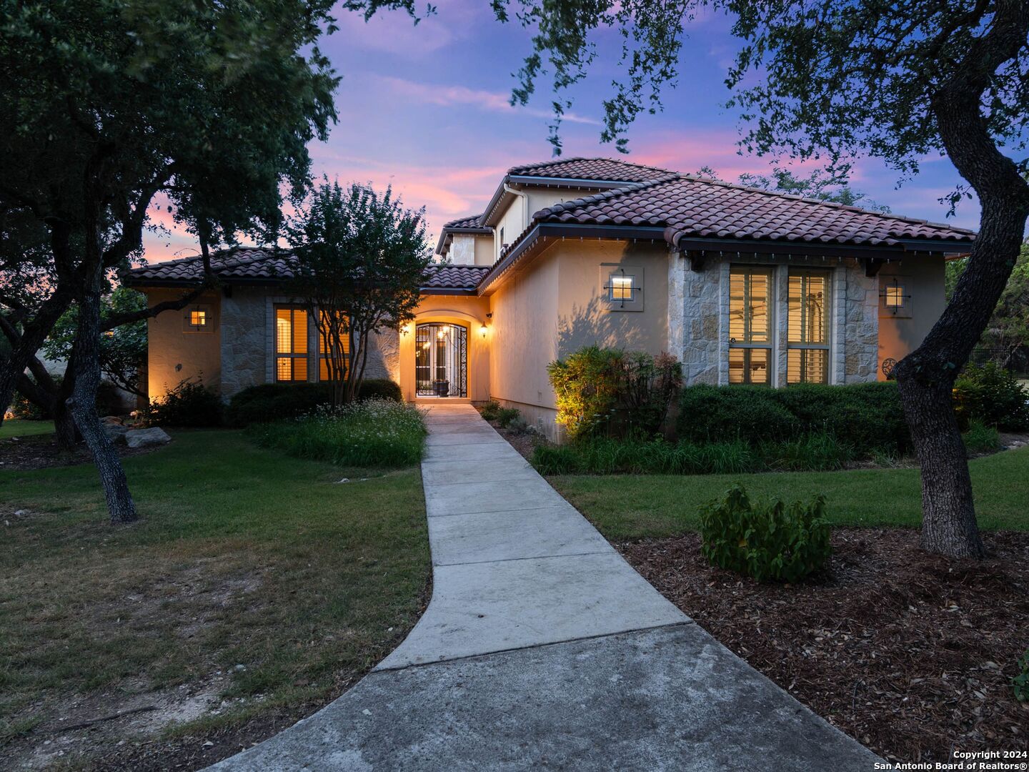 a front view of a house with garden