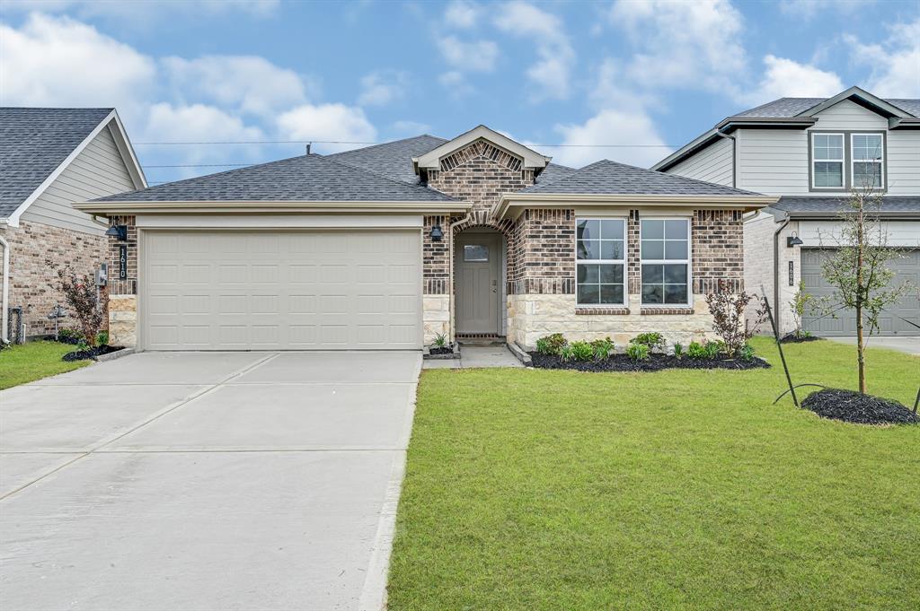 front view of a house with a yard