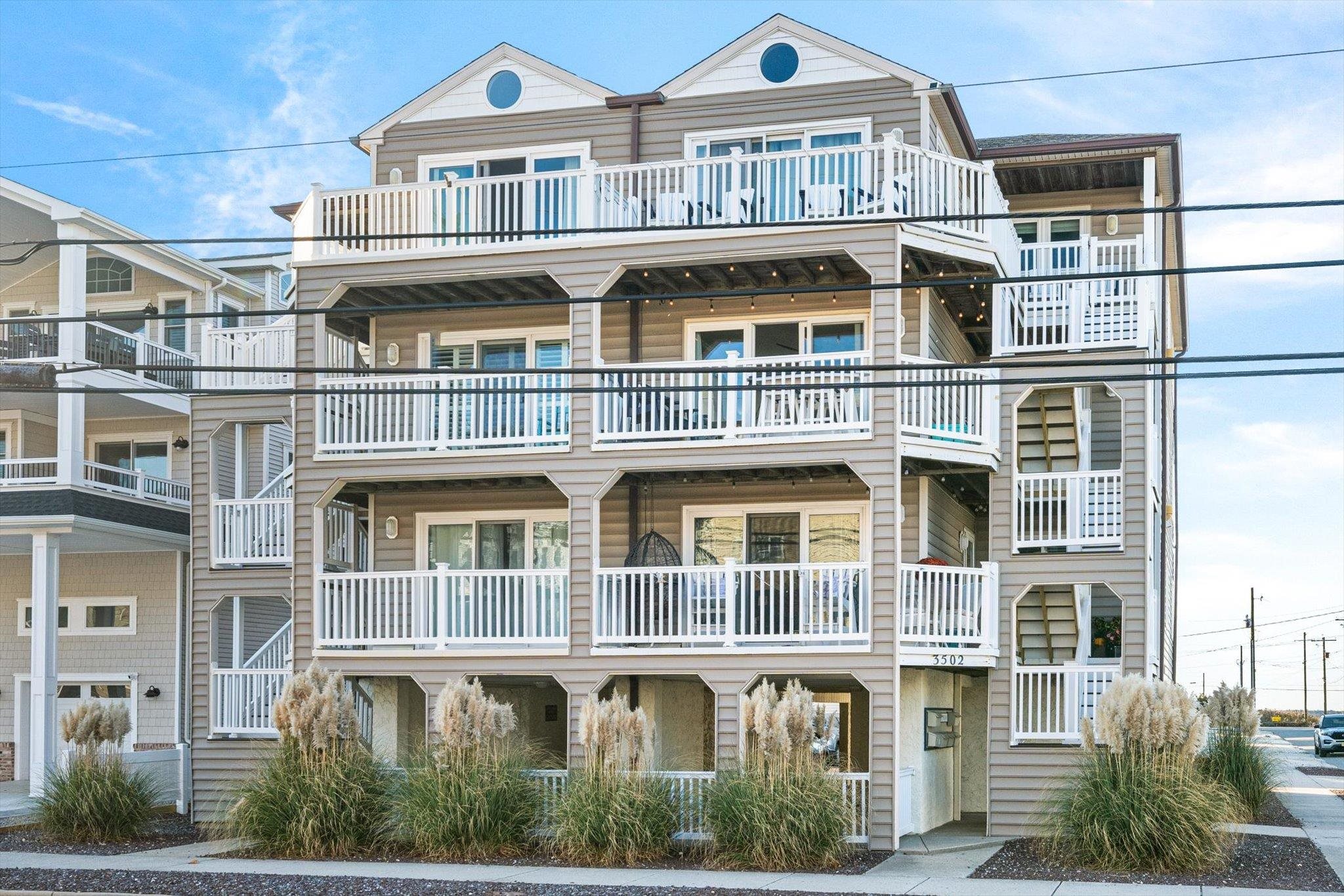 a front view of a building with a lot of windows