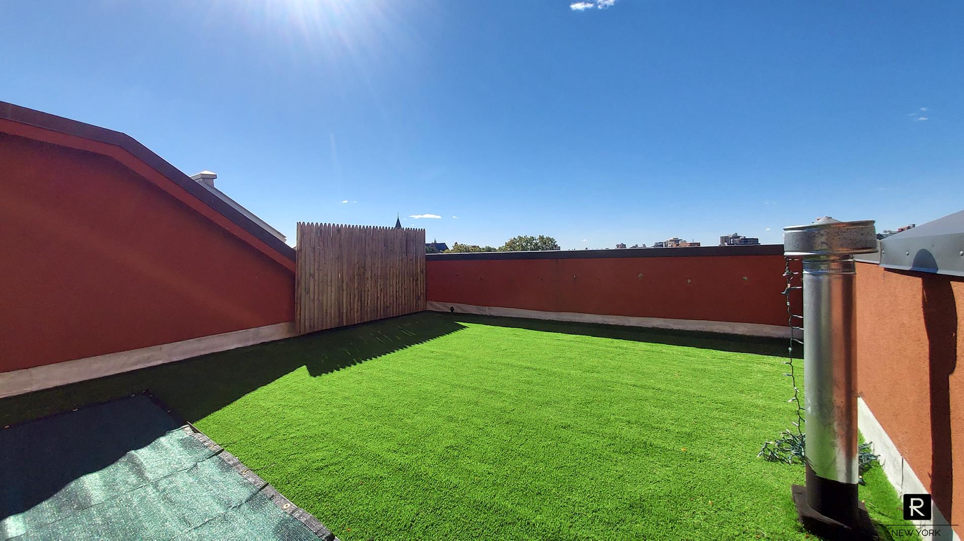 a view of a backyard with potted plants