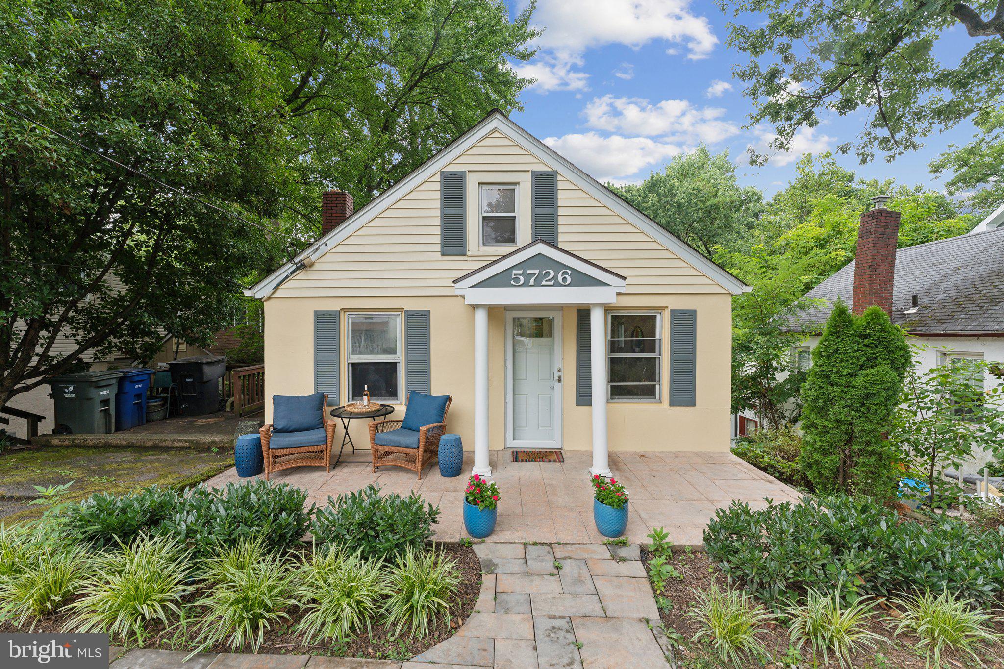 a front view of a house with a porch