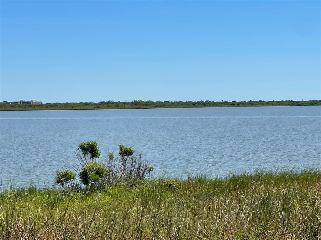 a view of a lake with a big yard