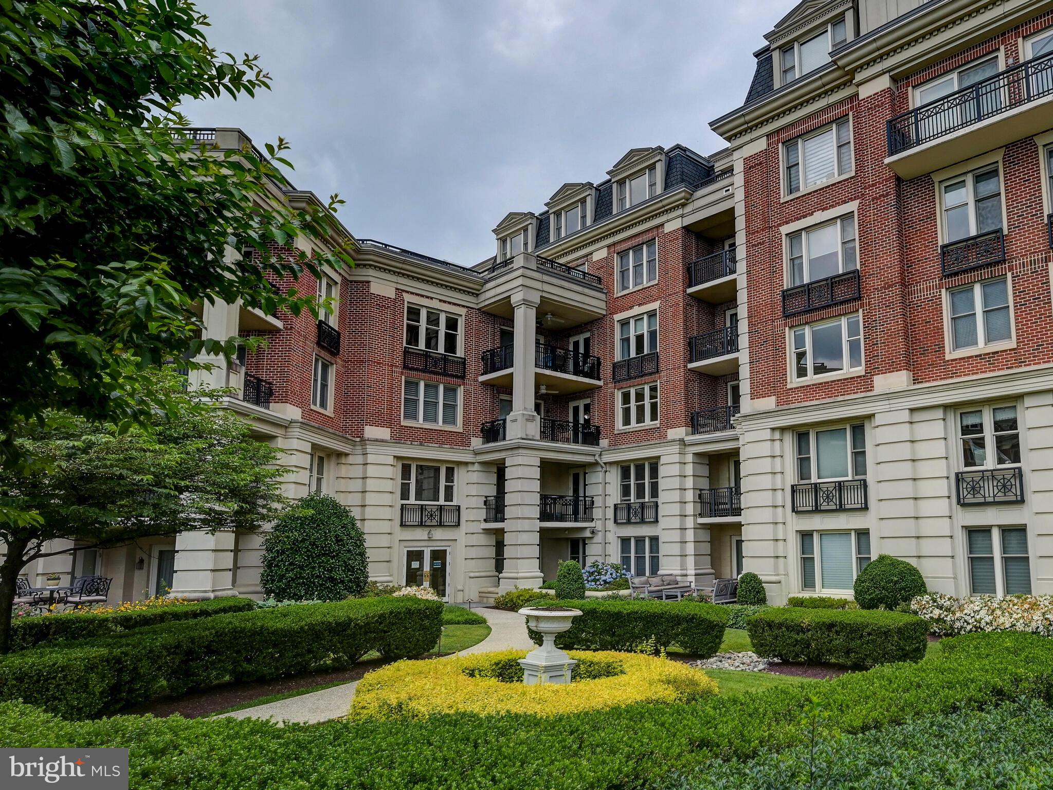 a front view of a building with a yard