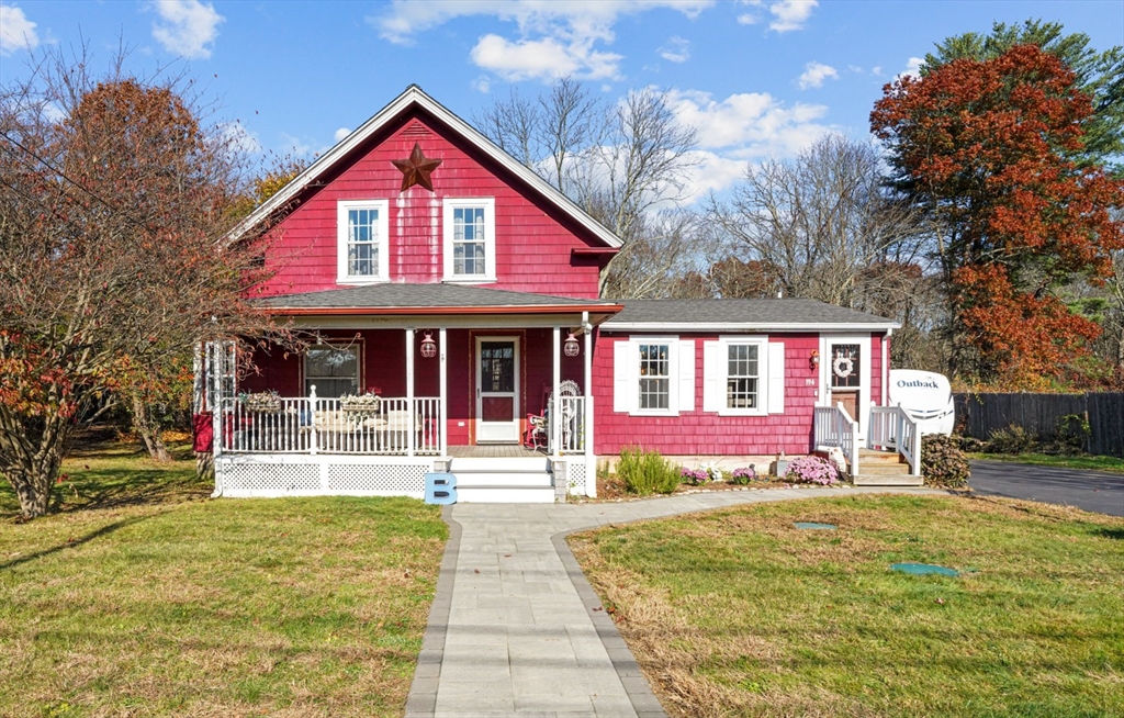 a front view of a house with a yard