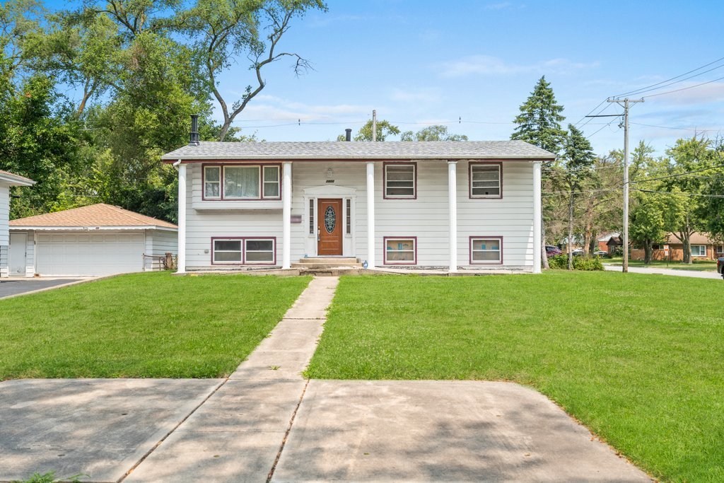 front view of a house with a yard