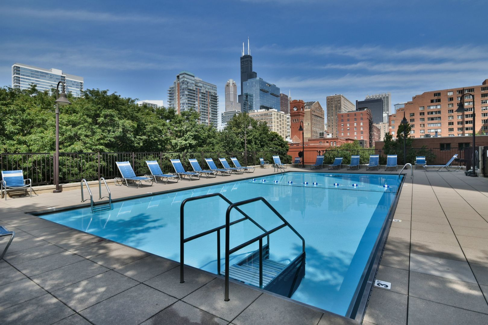 a view of swimming pool from a balcony