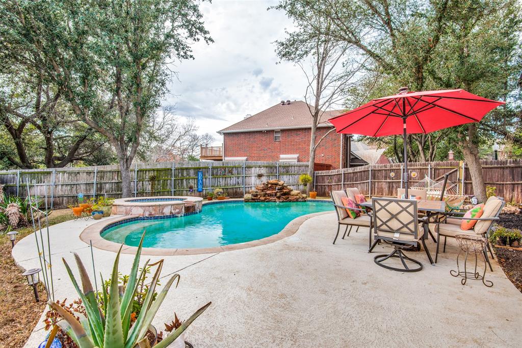 an outdoor space with pool and furniture