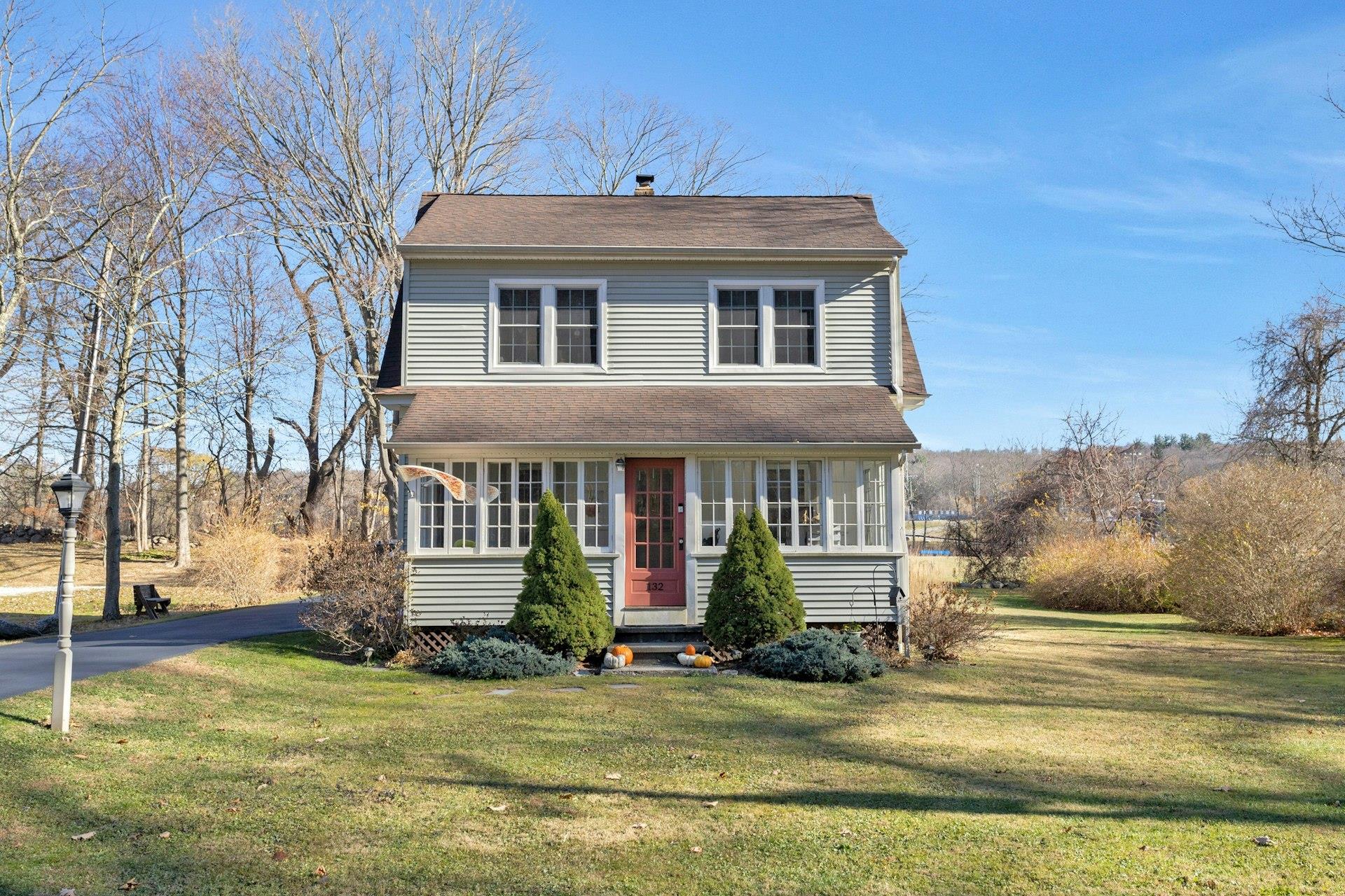 a front view of a house with a yard