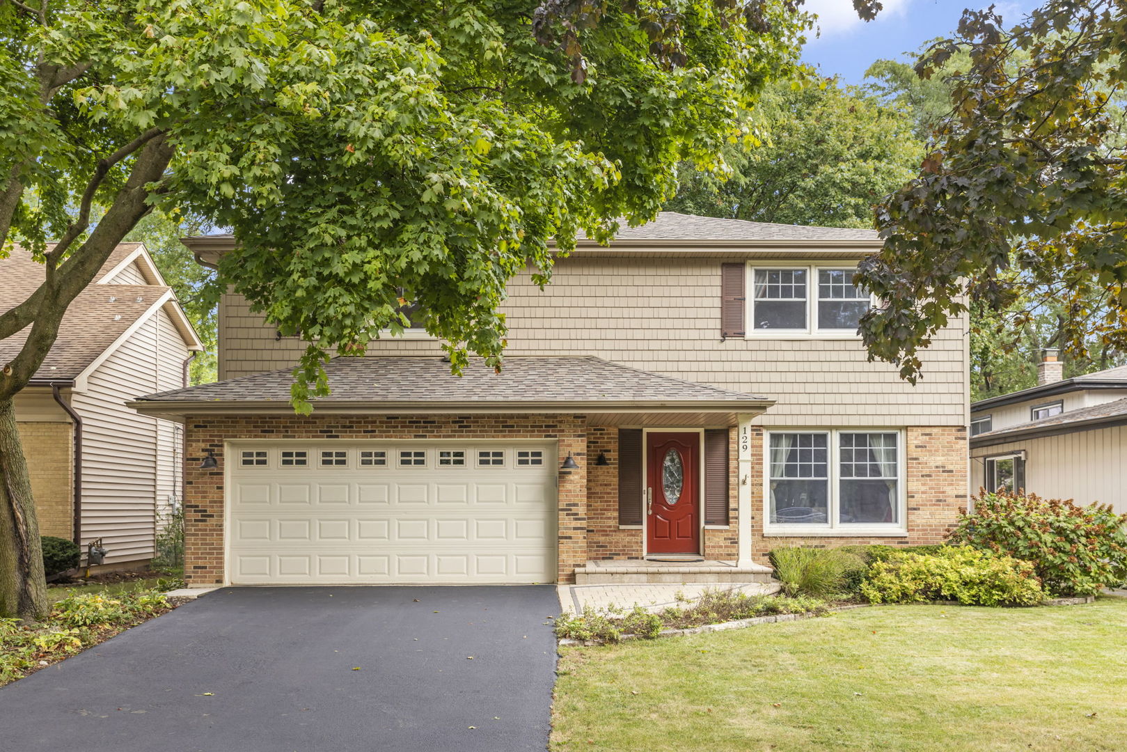 front view of a house with a yard