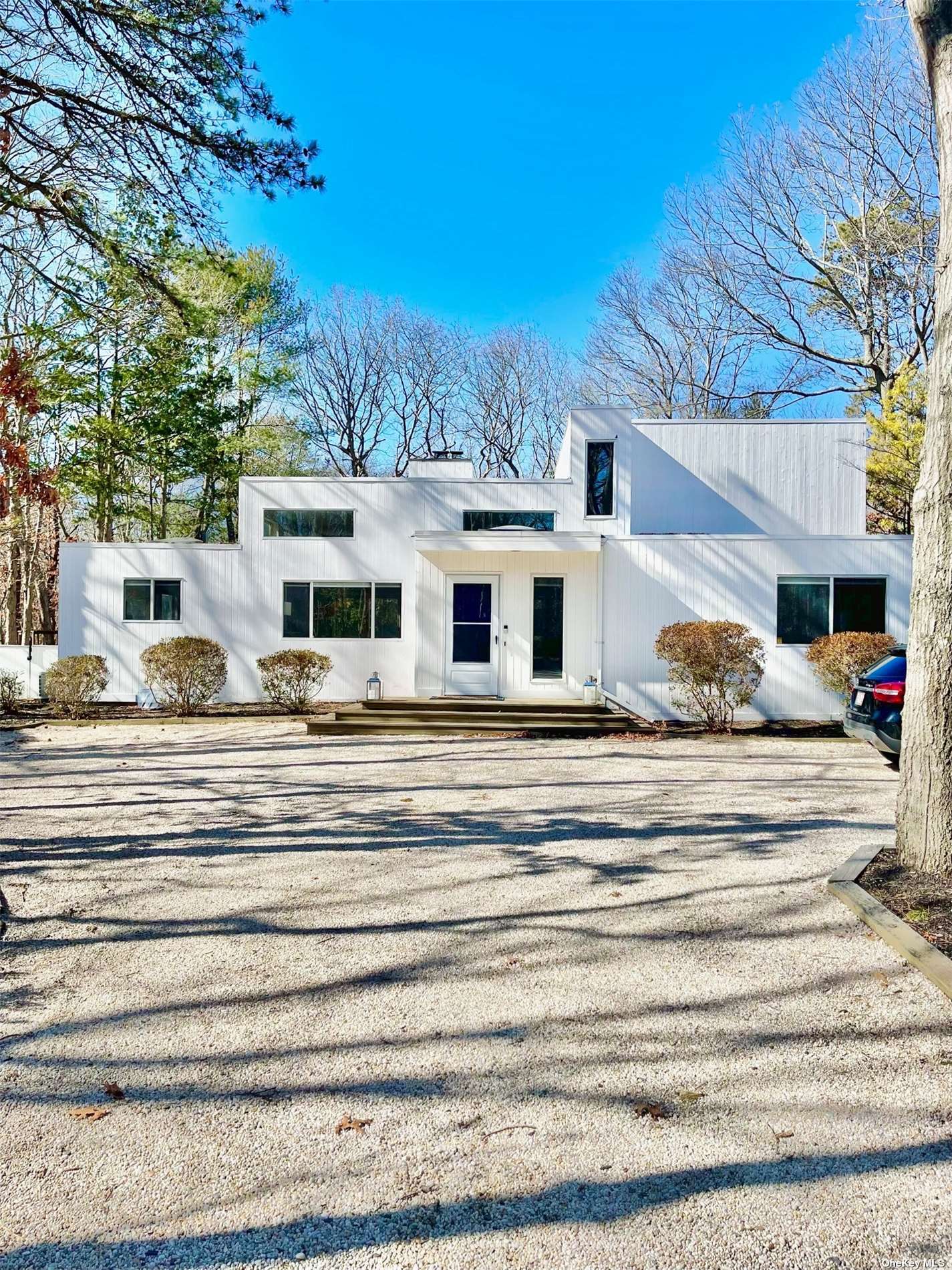 a front view of a house with a ocean view