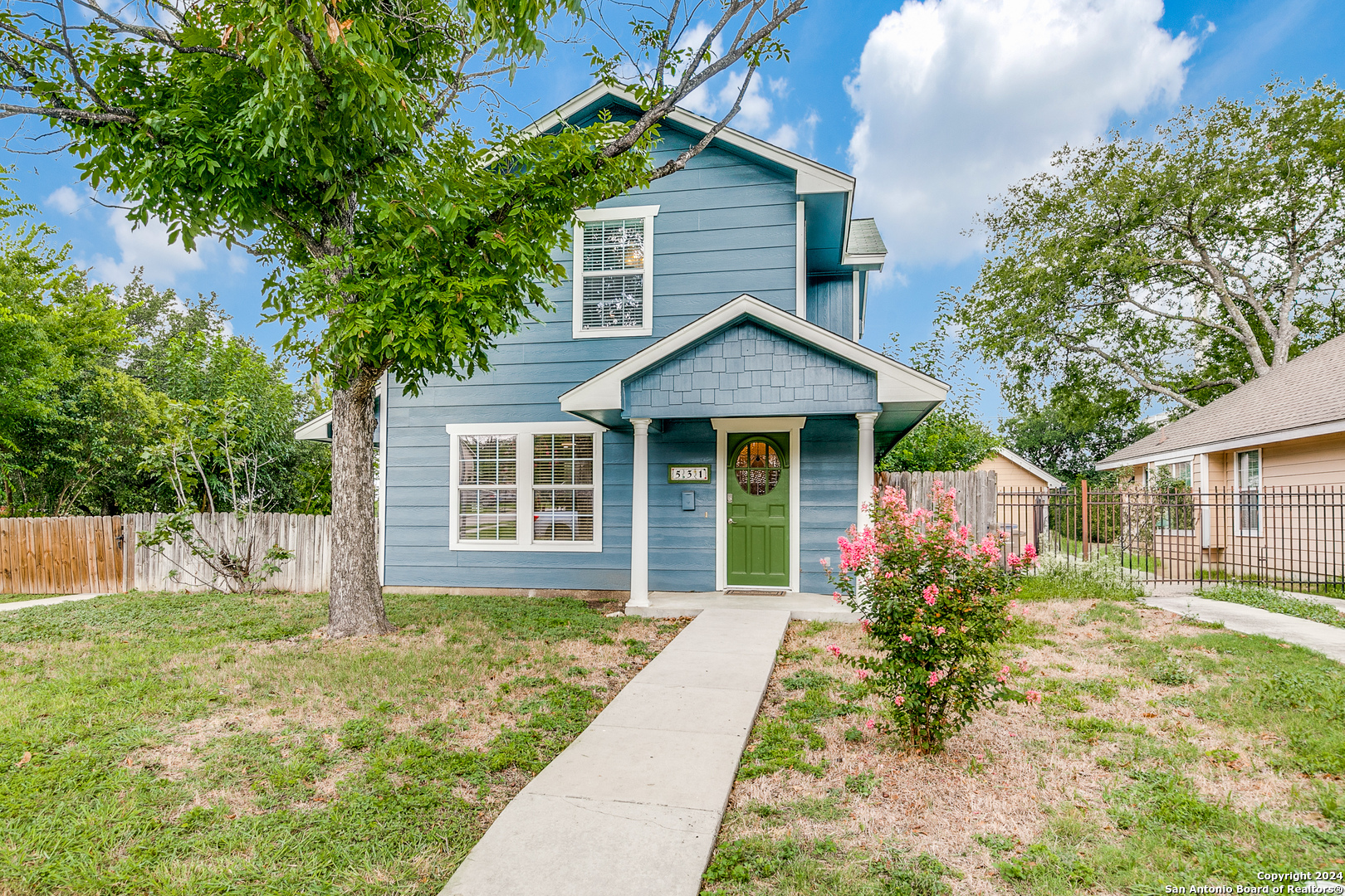 front view of a house with a yard