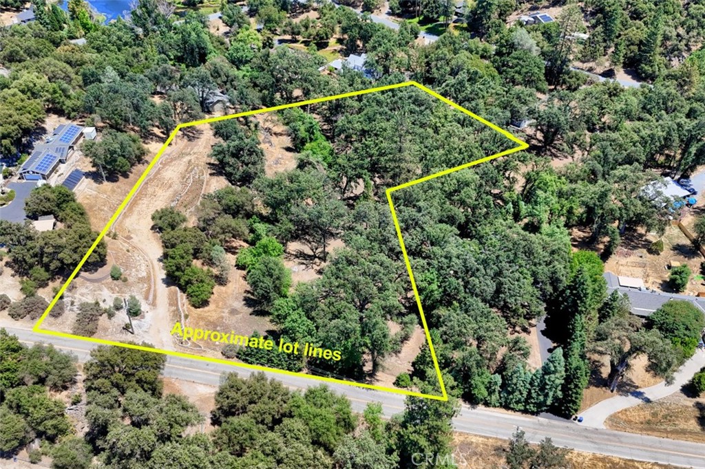 an aerial view of houses with yard