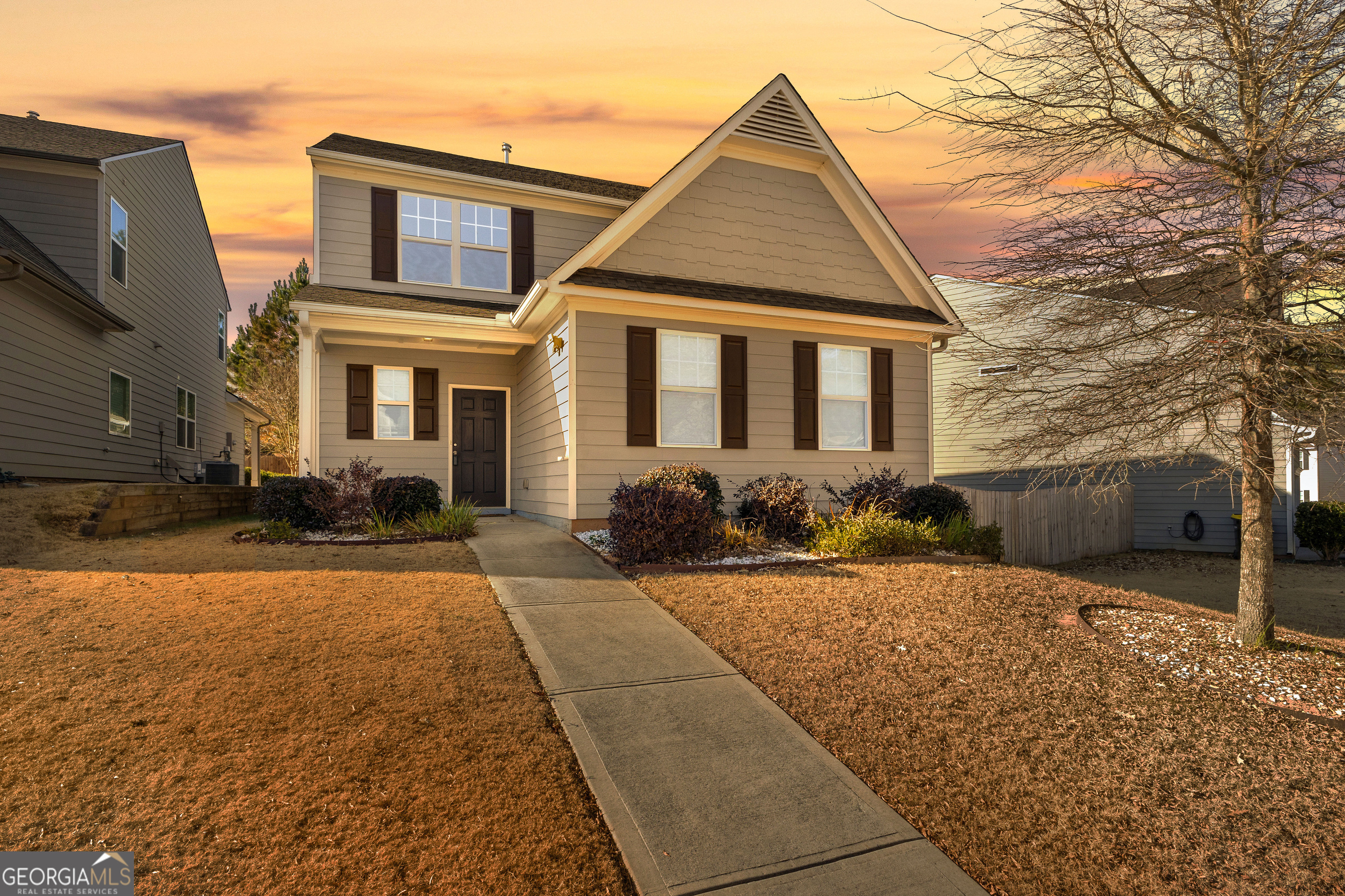 a front view of a house with yard