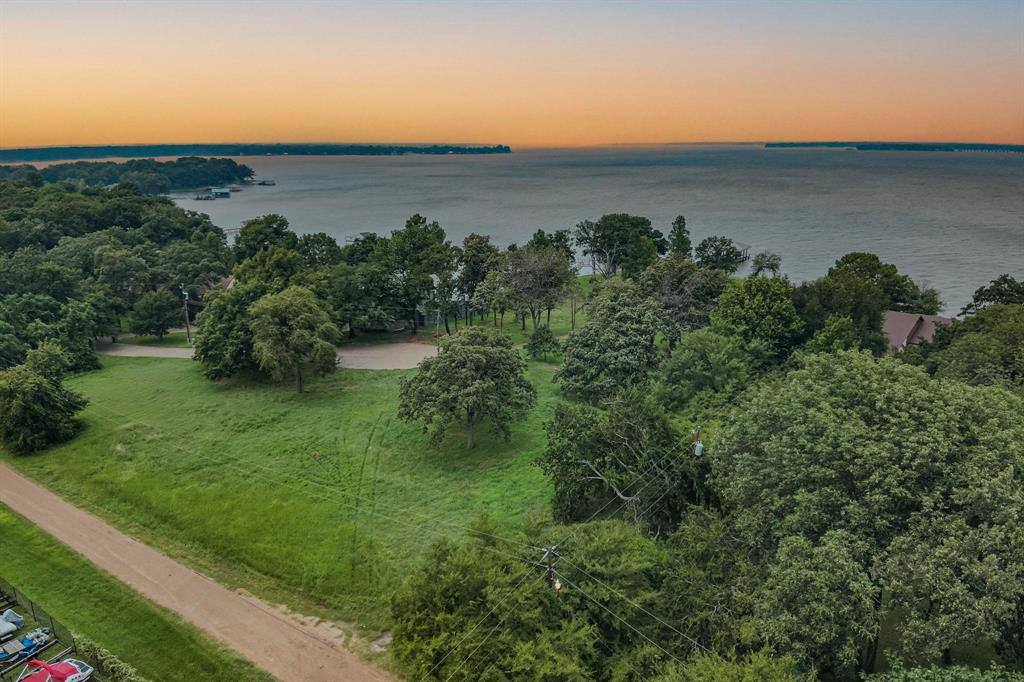 a view of a lake with a yard