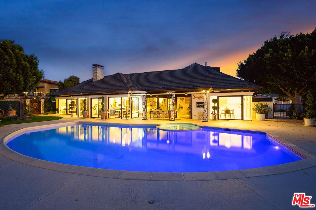 a view of swimming pool with seating area