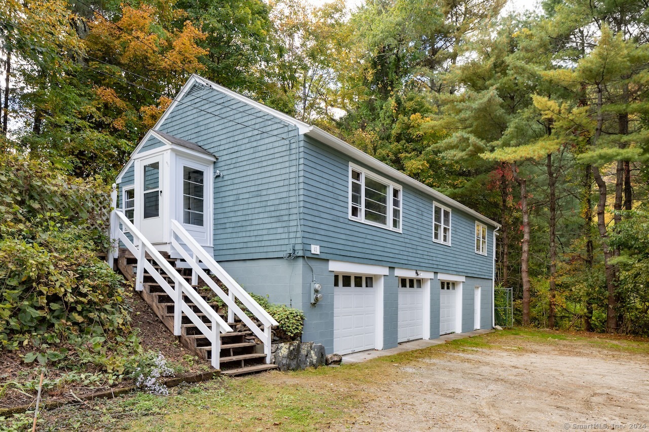 a front view of a house with stairs