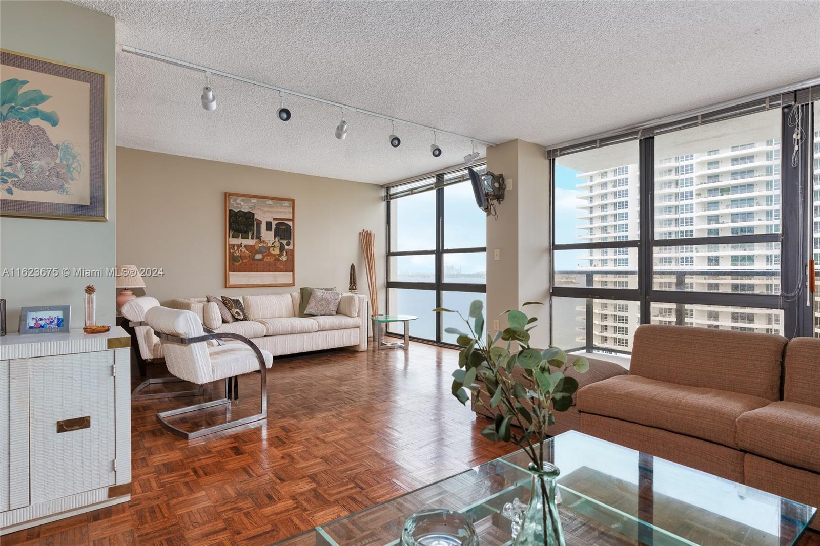 a living room with furniture and a large window